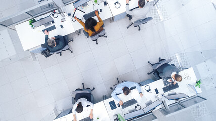 Poster - Top Down Shot of Big Busy Corporate Office with Tow Rows off Businessmen and Businesswomen Working on Desktop Computers. Bright Open Space Office with Businesspeople and Salespeople