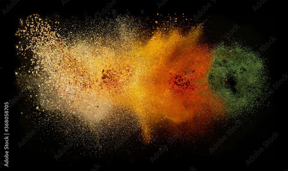 Freeze motion of spice explosion, black background - obrazy, fototapety, plakaty 