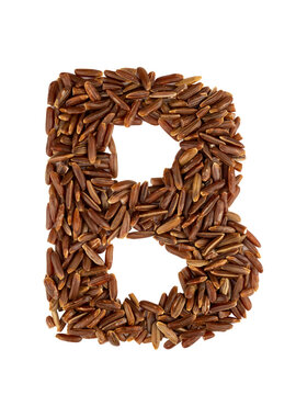 Letter B of the English alphabet made from brown rice on an isolated background.