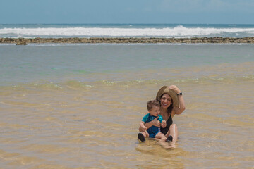 Wall Mural - playing on the shallow golden beach 