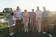 © AnnaStills - Portrait of happy big family have a party outdoors in the country