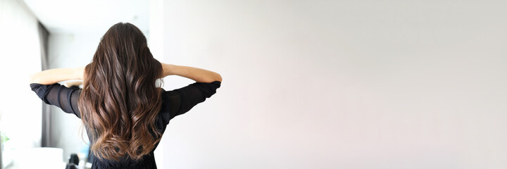 lady demonstrating new hair styling