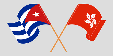 Crossed and waving flags of Cuba and Hong Kong