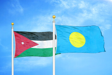 Jordan and Palau two flags on flagpoles and blue cloudy sky