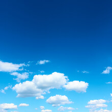 Dark Blue Sky With White Clouds