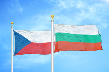 Czech and Bulgaria two flags on flagpoles and blue cloudy sky