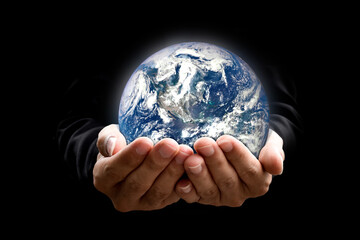 Canvas Print - environment concept. earth in hands on black background. elements of this image furnished by nasa