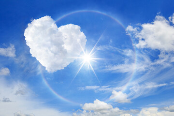 sun halo with heart cloud on the blue sky, cloud shaped heart on blue sky white cloud background.