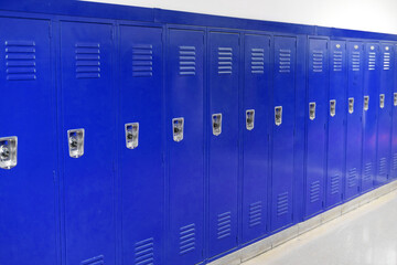 close up on blue lockers in the school