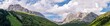 Panorama von Partnun mit Sulzfluh, Weißplatte und Scheienfluh als  im Sommer bei blauem Himmel mit weißen Wolken
