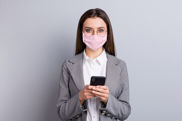 Poster - Close-up portrait of her she attractive businesslady wearing safety pink reusable mask using device gadget mers cov influenza remote distance discuss chatting isolated grey color background