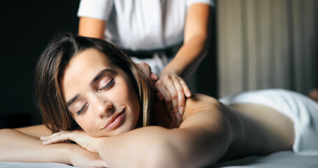 Wall Mural - Young and healthy woman in spa salon. Traditional Swedish massage therapy