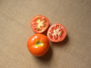 Wall Mural - Whole and cut orange and yellow color whole ripe tomatoes