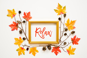 Wall Mural - golden frame with english text relax. beautiful, colorful autumn leaf decoration with maple leaf and