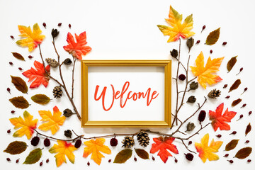 Wall Mural - golden frame with english text welcome. beautiful, colorful autumn leaf decoration with maple and be