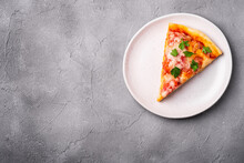 Hot Pizza Slice With Mozzarella Cheese, Ham, Tomato And Parsley On Plate, Stone Concrete Background, Top View Copy Space For Text