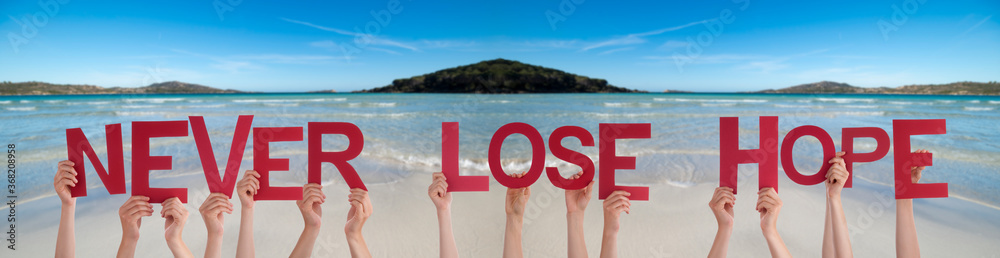 People Hands Holding Colorful English Word Never Lose Hope. Ocean And Beach As Background - obrazy, fototapety, plakaty 