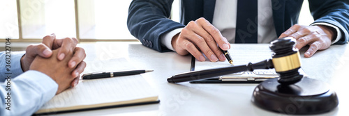 Fotografía Male lawyer and businesswoman working and discussion having at law firm in offic