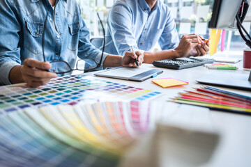 Poster - Two creative graphic designer working on color selection and color swatches