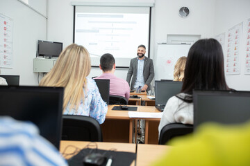 University professor lecturing small group of students