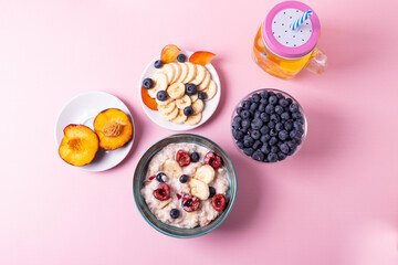 porridge, fruit and berries as healthy yummy breakfast concept