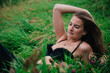 © Denis - Beautiful girl in black bra and long skirt lies in the grass