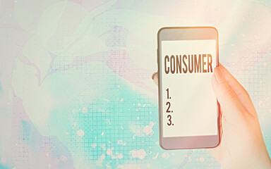 Word writing text Consumer. Business photo showcasing one that utilizes economic goods that are sold by manufacturers Modern gadgets with white display screen under colorful bokeh background