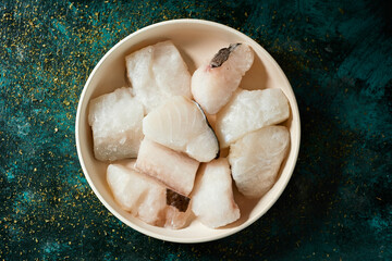 Canvas Print - pieces of frozen uncooked codfish in a plate