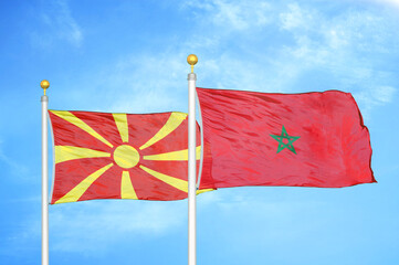 North Macedonia and Morocco two flags on flagpoles and blue sky