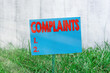 Handwriting text Complaints. Conceptual photo something that is the cause or subject of protest or outcry Plain empty paper attached to a stick and placed in the green grassy land