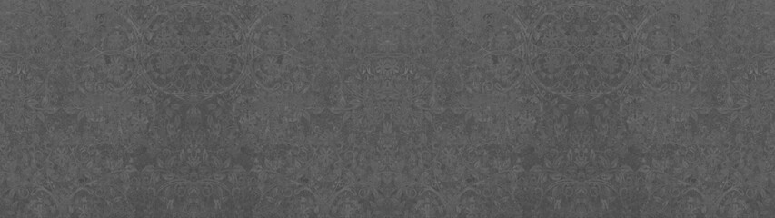 old grunge anthracite gray grey vintage cement texture with floral seamless pattern print tiles wallpaper texture background banner panorama
