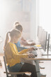© Gorodenkoff - Vertical Shot in Elementary School Computer Science Classroom: Rows of Diverse Little Smart Schoolchildren using Personal Computers, Learn Informatics, Internet Safety, Programming Language for Coding