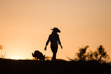 Cow Girl And Working Dog Silhouette