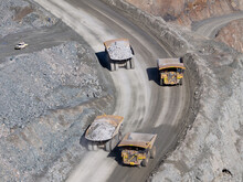 Mining Trucks Moving Along Roadway Of An Open Cut Mine