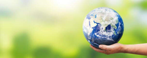 Hand holding Earth globe. World environment day. Elements of this image furnished by NASA
