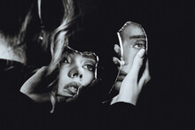 Lovely Woman Looking At Broken Self-image Mirror, Black And White Retro Portrait