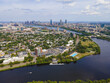 Aerial view of Boston modern city skyline (far) and Cambridge (near) divided by Charles River, Boston, Massachusetts MA, USA. 