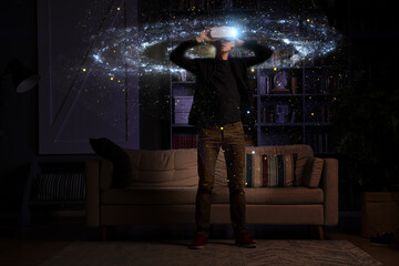 Wall Mural - man uses virtual reality glasses to see the galaxy space. elements of this image furnished by nasa.