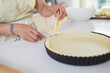 © Sam Edwards/Caia Image - Close up woman cutting edge of pie crust