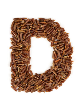 Letter D of the English alphabet made from brown rice on an isolated background.