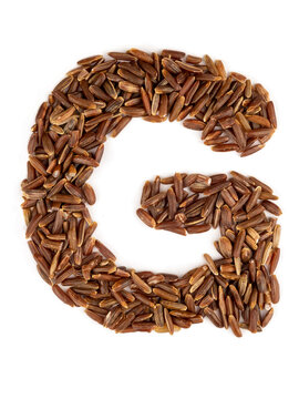 Letter G of the English alphabet made from brown rice on an isolated background.
