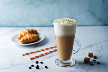 Wall Mural - Coffee with whipped cream in a glass with coffee beans