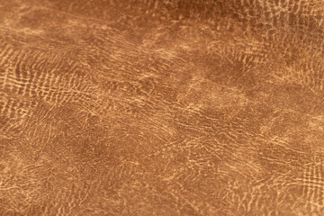 brown faux suede leather for the concept and style idea of fine leather craft, handmade work space.