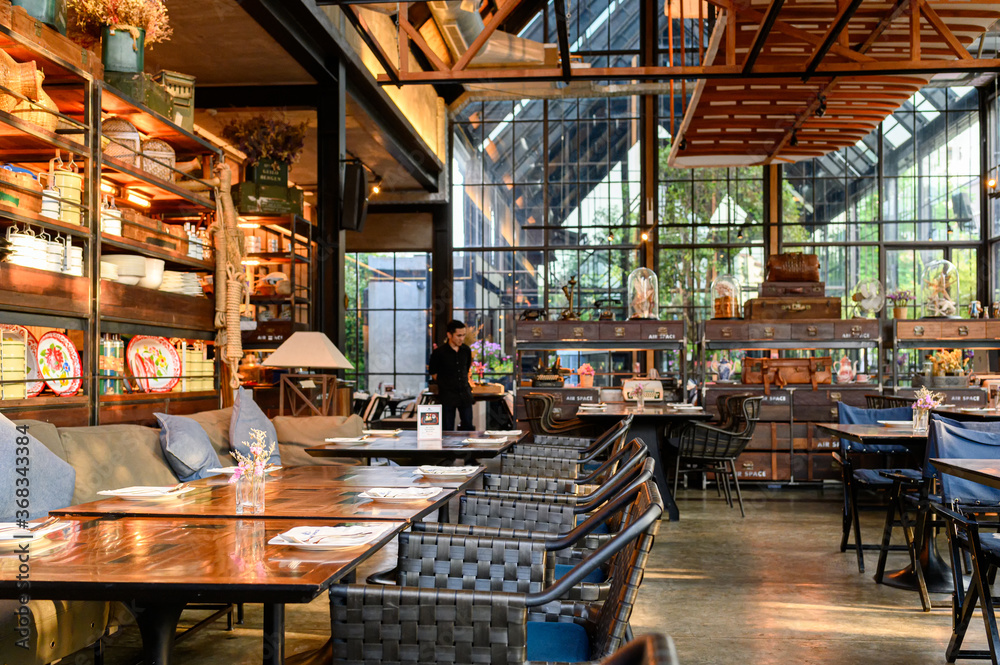 Restaurant modern industrial design with dining table and ancient ...