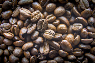 Closeup of a large amount of roasted coffee beans