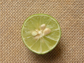 Wall Mural - Cut cross section detail of green raw fresh Lime fruit
