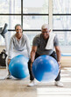 © Erik Isakson - happy senior couple exercising in gym