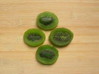 Wall Mural - Green color dried round Kiwi slices