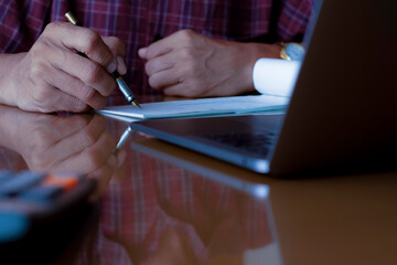 Wall Mural - Business man write and sign cheque.