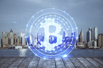 Double exposure of crypto currency theme hologram drawing and city veiw background. Concept of blockchain and bitcoin.